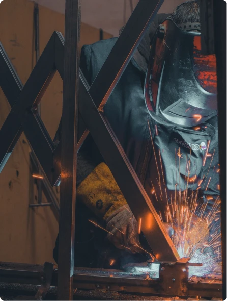 Austin Rhoades welding at AR Fabrication shop